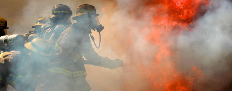 firefighters battling blaze and smoke